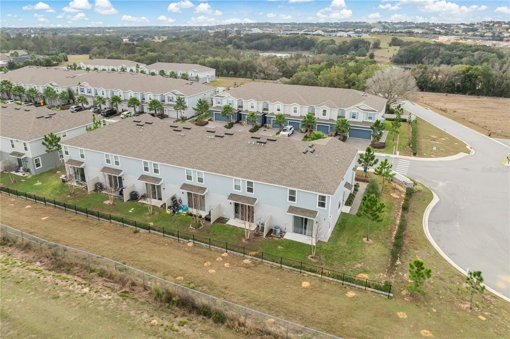 1943 Holden Ridge Ln. Clermont, FL 34715 - Photo 53 of 59 an aerial view of a house with a lake