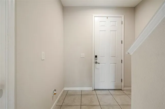 a bathroom with a sink mirror and toilet