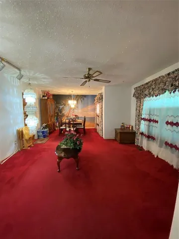 a bed room with furniture and a flat screen tv