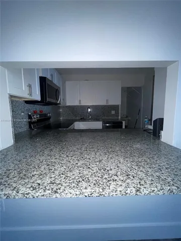 a living room with a couch and a stove