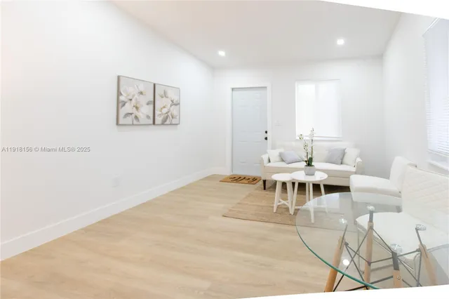 a living room with furniture and a table