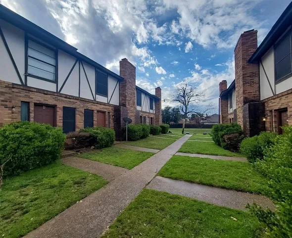 a view of a big yard next to a building