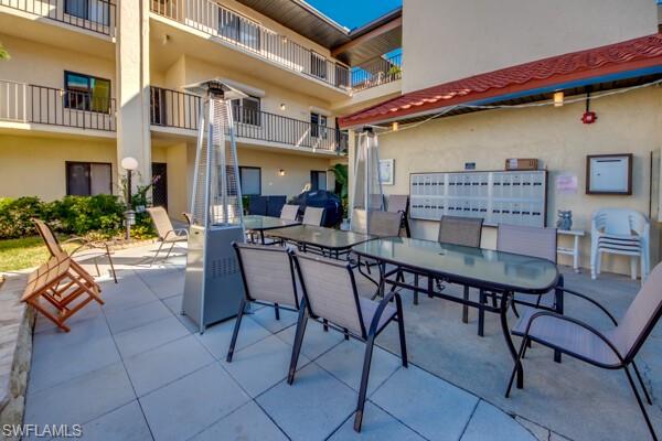 11110 Caravel Circle, Unit 205 Fort Myers, FL 33908 - Photo 23 of 45 a view of a chairs and table in a patio