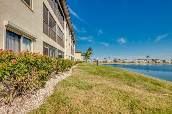 11110 Caravel Circle, Unit 205 Fort Myers, FL 33908 - Photo 25 of 45 a view of a swimming pool with an outdoor seating