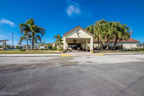 11110 Caravel Circle, Unit 205 Fort Myers, FL 33908 - Photo 37 of 45 front view of a house with a small yard