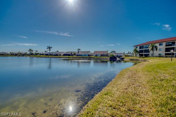 11110 Caravel Circle, Unit 205 Fort Myers, FL 33908 - Photo 38 of 45 a view of a lake with houses