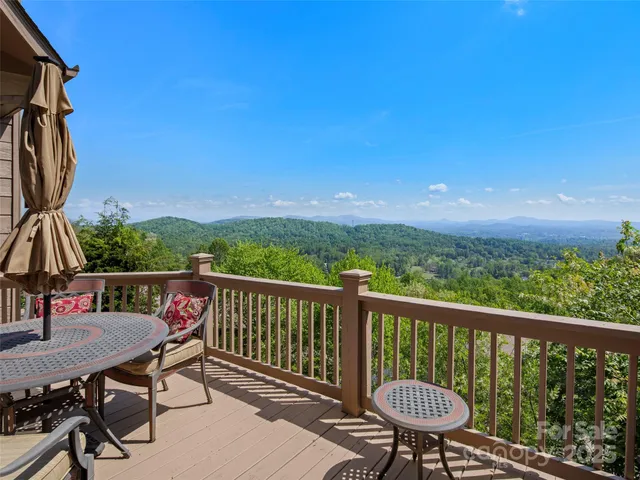 a view of a balcony with chairs