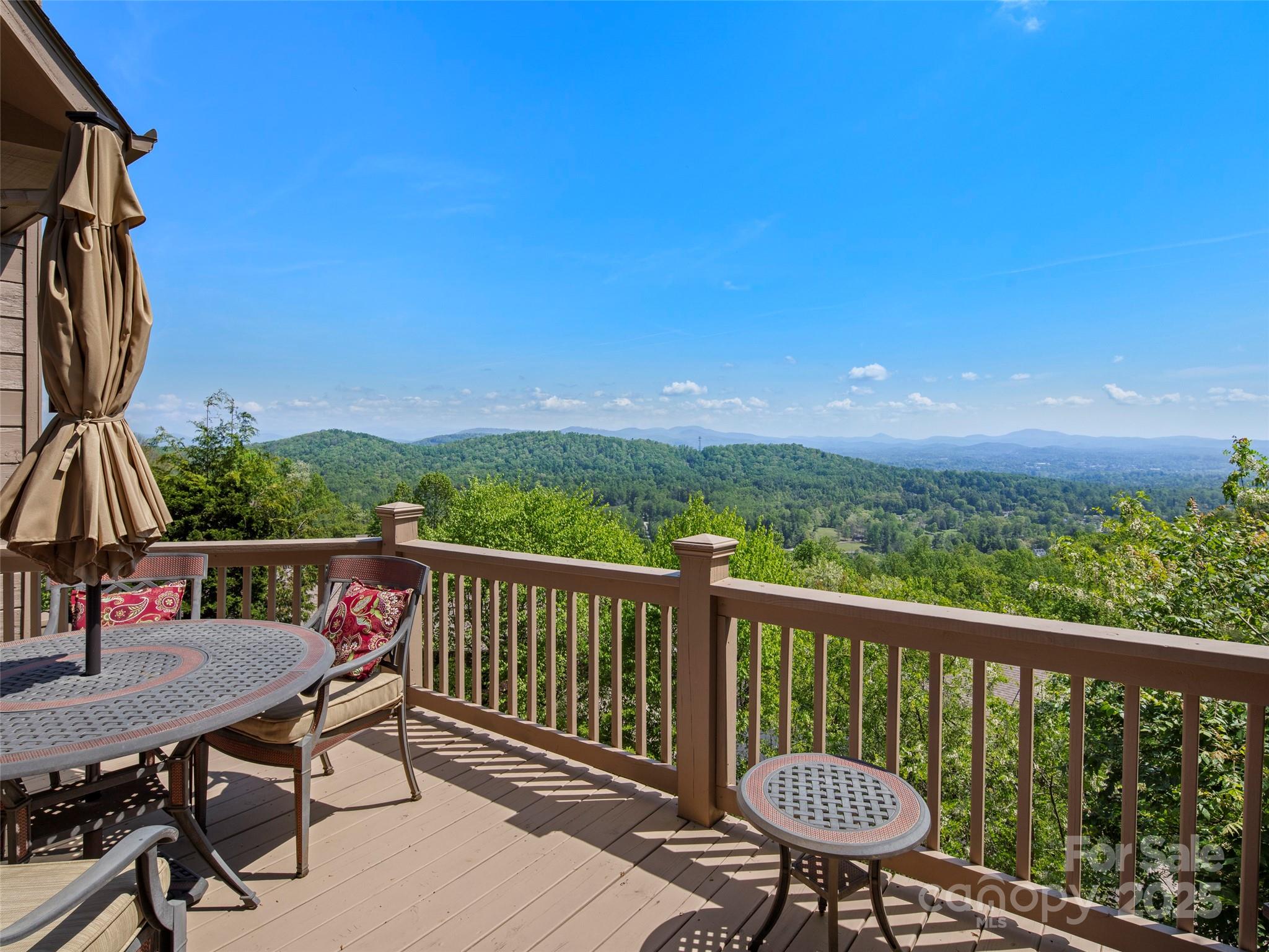 a view of a balcony with chairs