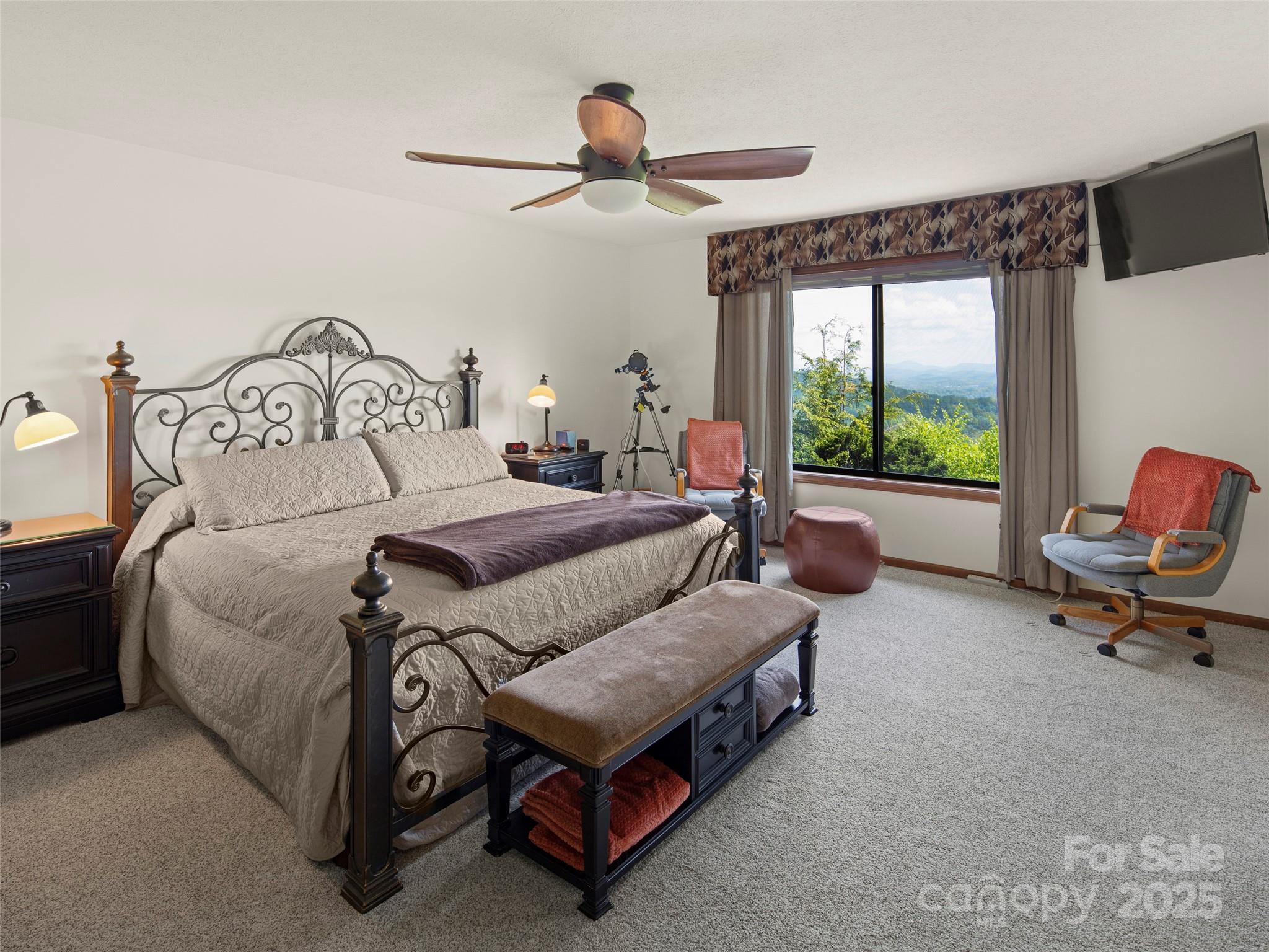 167 Country Ridge Road Laurel Park, NC 28739 - Photo 19 of 27 a bedroom with a bed and window
