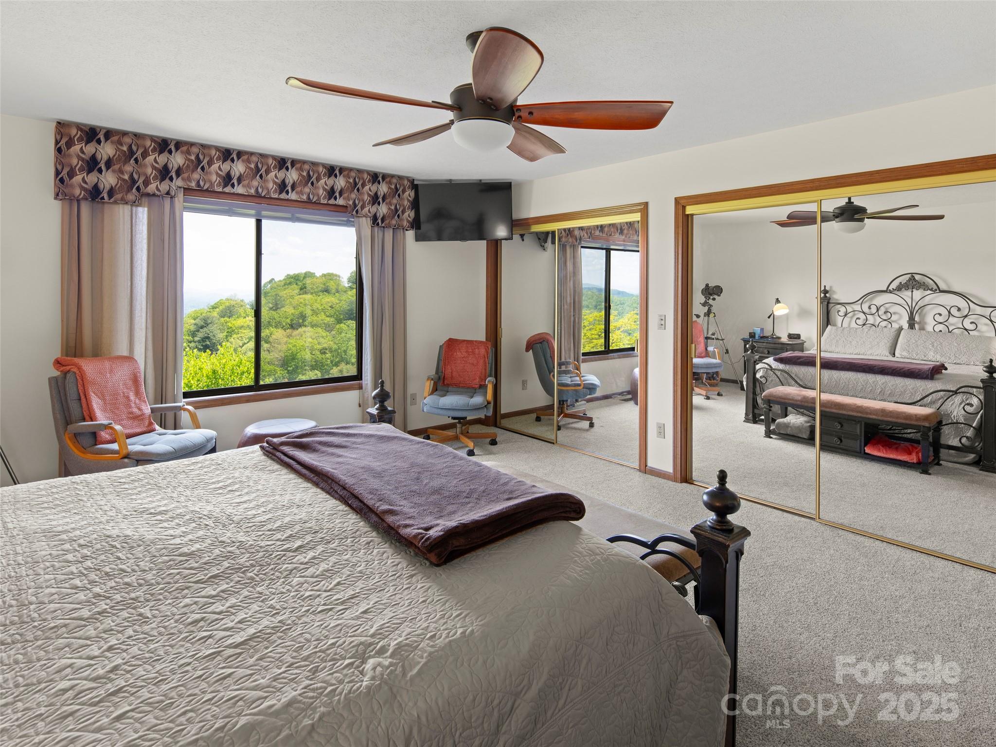 167 Country Ridge Road Laurel Park, NC 28739 - Photo 20 of 27 a bedroom with a bed and large windows