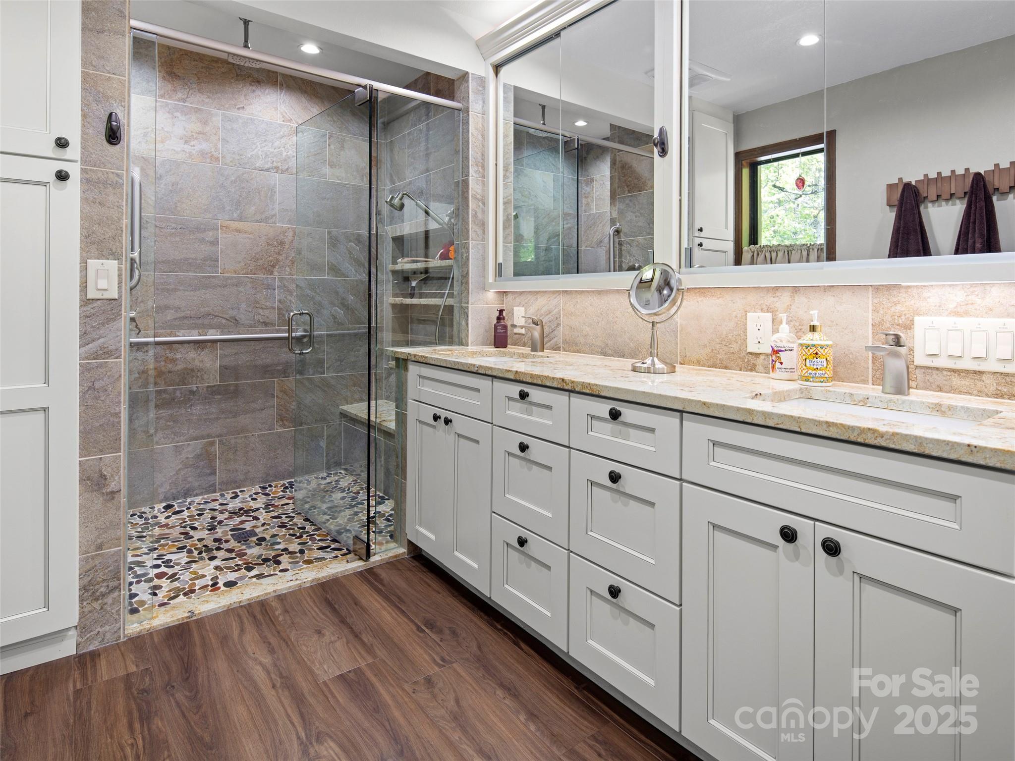 167 Country Ridge Road Laurel Park, NC 28739 - Photo 21 of 27 a bathroom with a shower sink and mirror