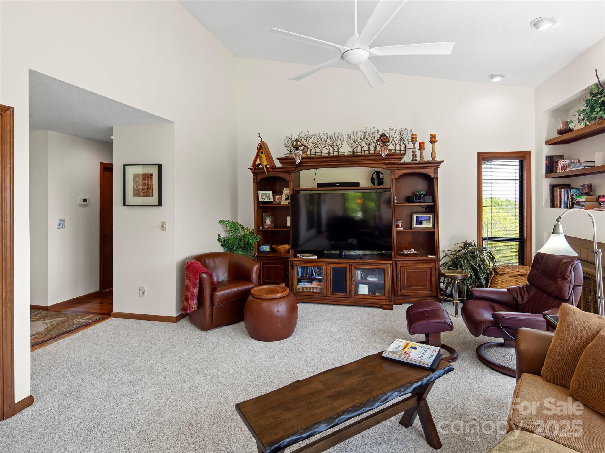 167 Country Ridge Road Laurel Park, NC 28739 - Photo 8 of 27 a living room with furniture and a flat screen tv