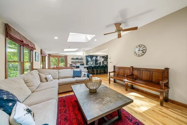 a living room with furniture and a rug