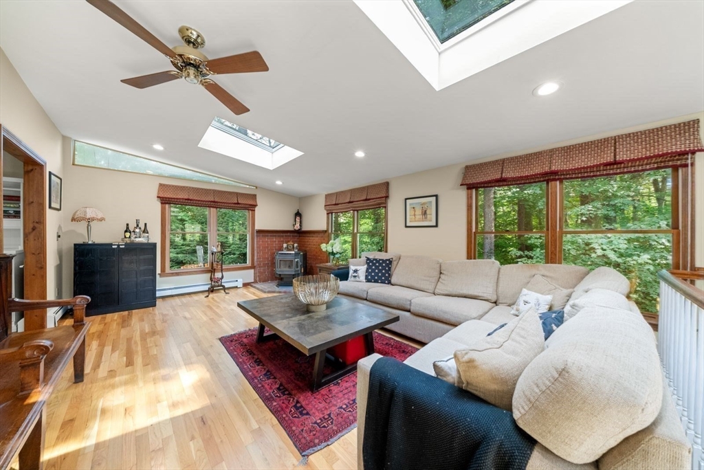 44 Gilmore Road Southborough, MA 01772 - Photo 12 of 40 a living room with furniture large window and flat screen tv