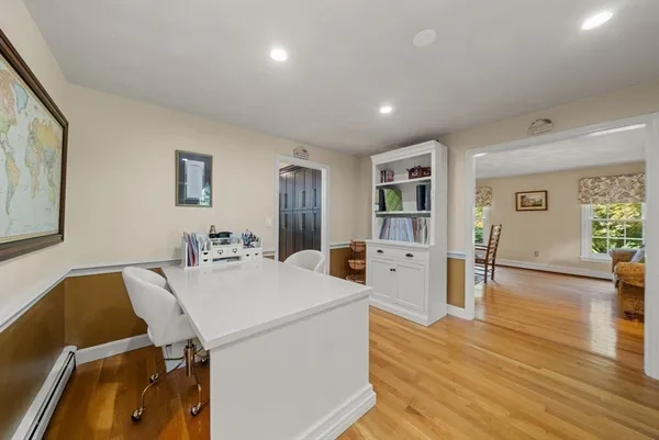 a view of living room with furniture and wooden floor