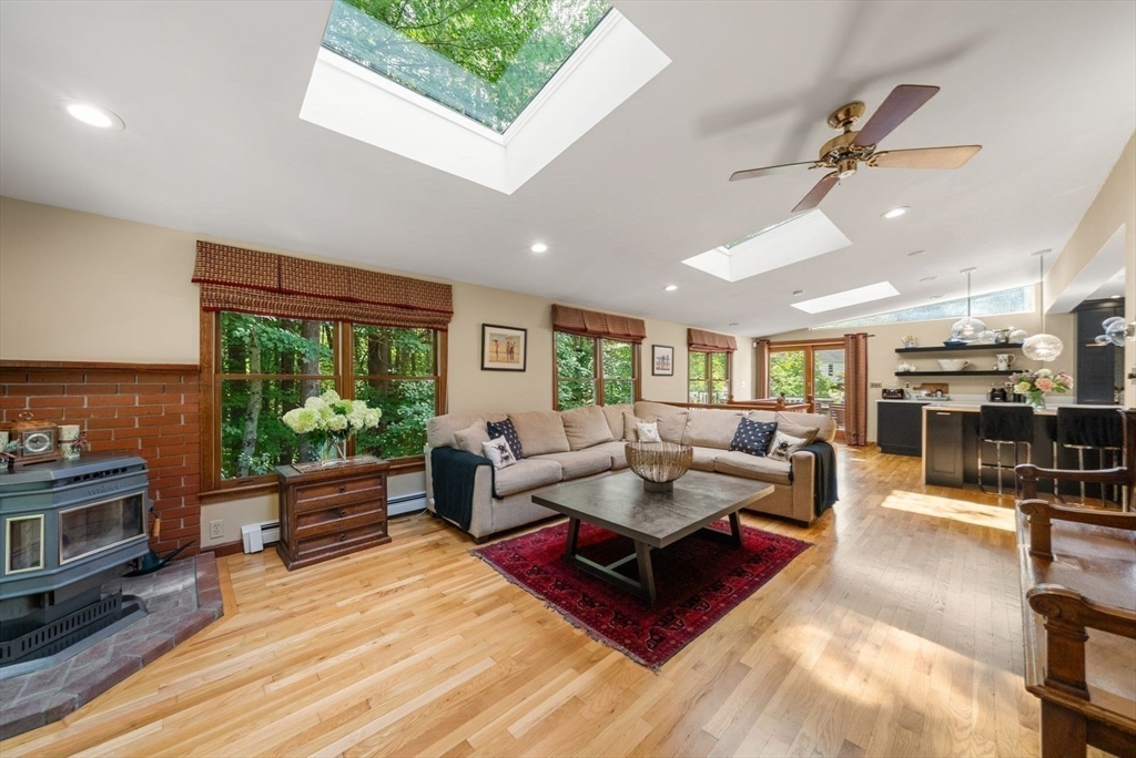 44 Gilmore Road Southborough, MA 01772 - Photo 15 of 42 a living room with furniture and a fireplace