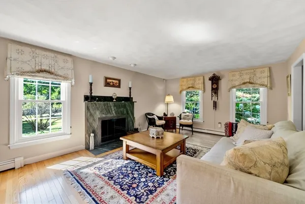 a living room with furniture and a fireplace