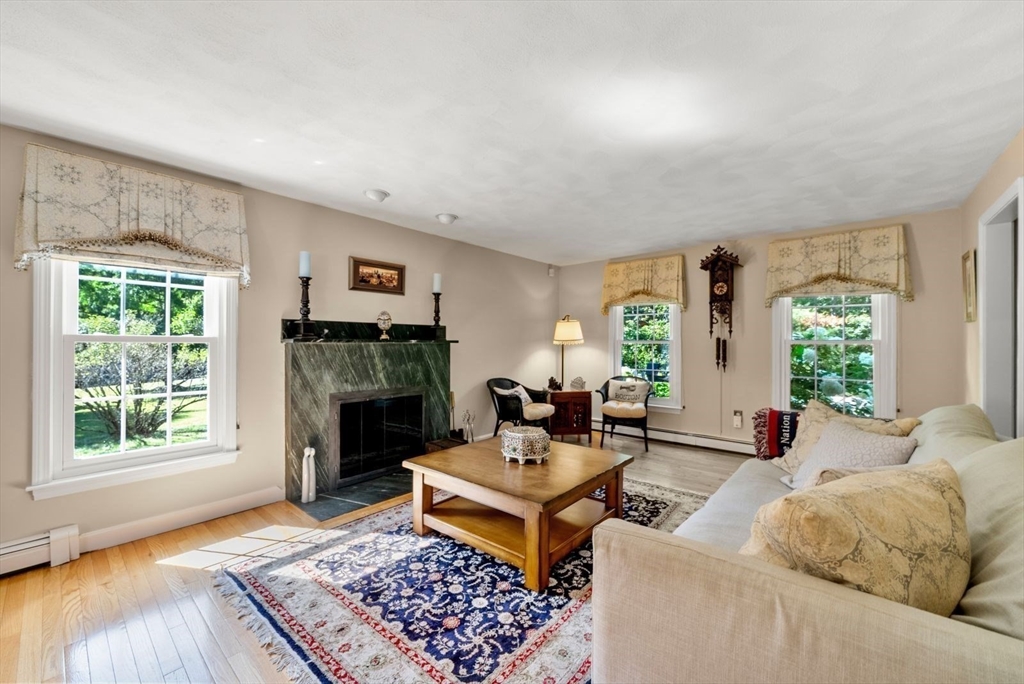 44 Gilmore Road Southborough, MA 01772 - Photo 20 of 40 a living room with furniture and a fireplace