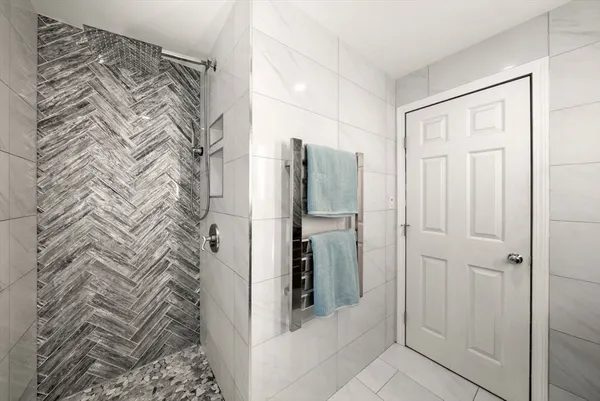 a bathroom with a shower and a sink