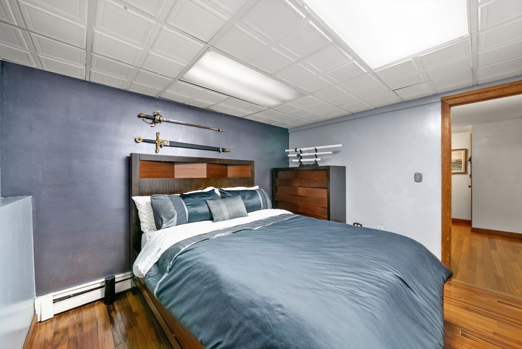 44 Gilmore Road Southborough, MA 01772 - Photo 34 of 42 a bedroom with a bed and wooden floor