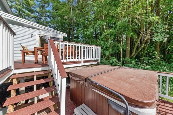 a view of a patio with wooden floor