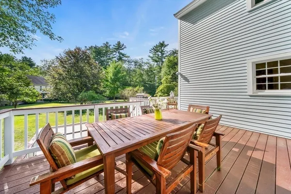 a view of a patio with a table and chairs