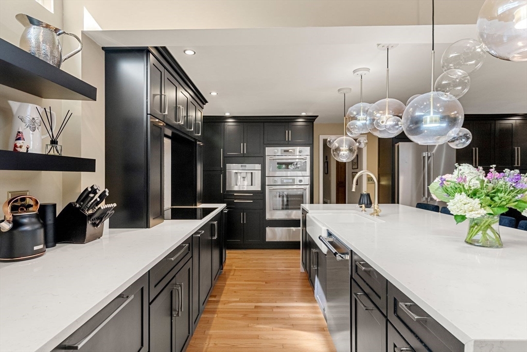 44 Gilmore Road Southborough, MA 01772 - Photo 6 of 42 a kitchen with counter top space and wooden floor