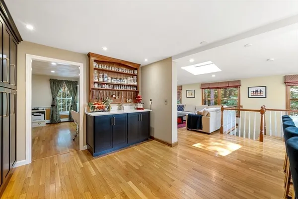 a view of a living room kitchen and a wooden floor