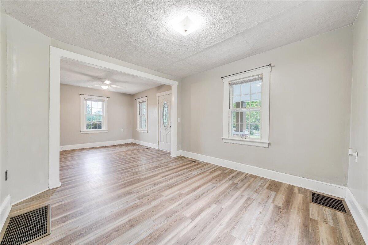1384 Thaxton Mountain Road Thaxton, VA 24174 - Photo 8 of 44 wooden floor in an empty room with a window