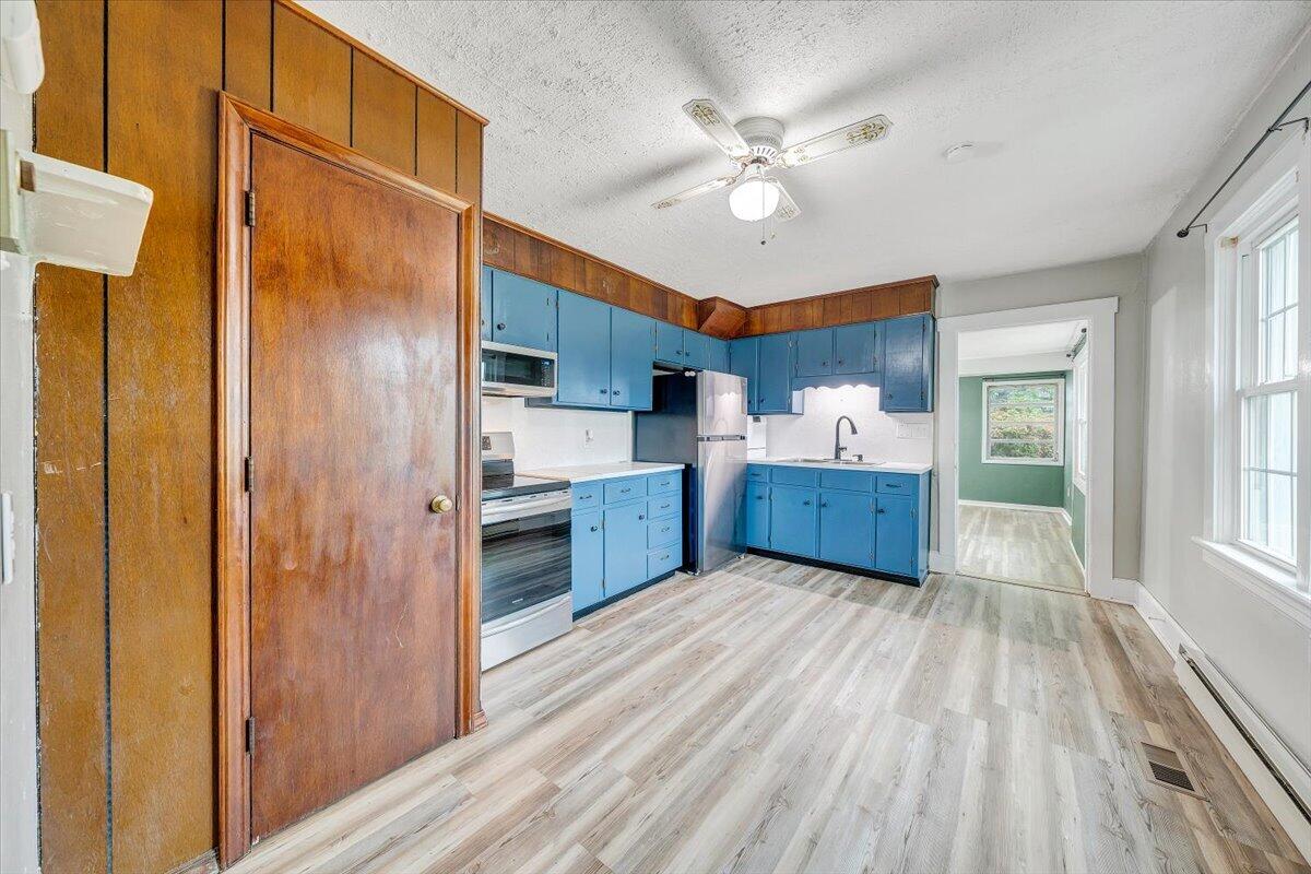 1384 Thaxton Mountain Road Thaxton, VA 24174 - Photo 12 of 44 a view of a kitchen with a sink cabinets and wooden floor