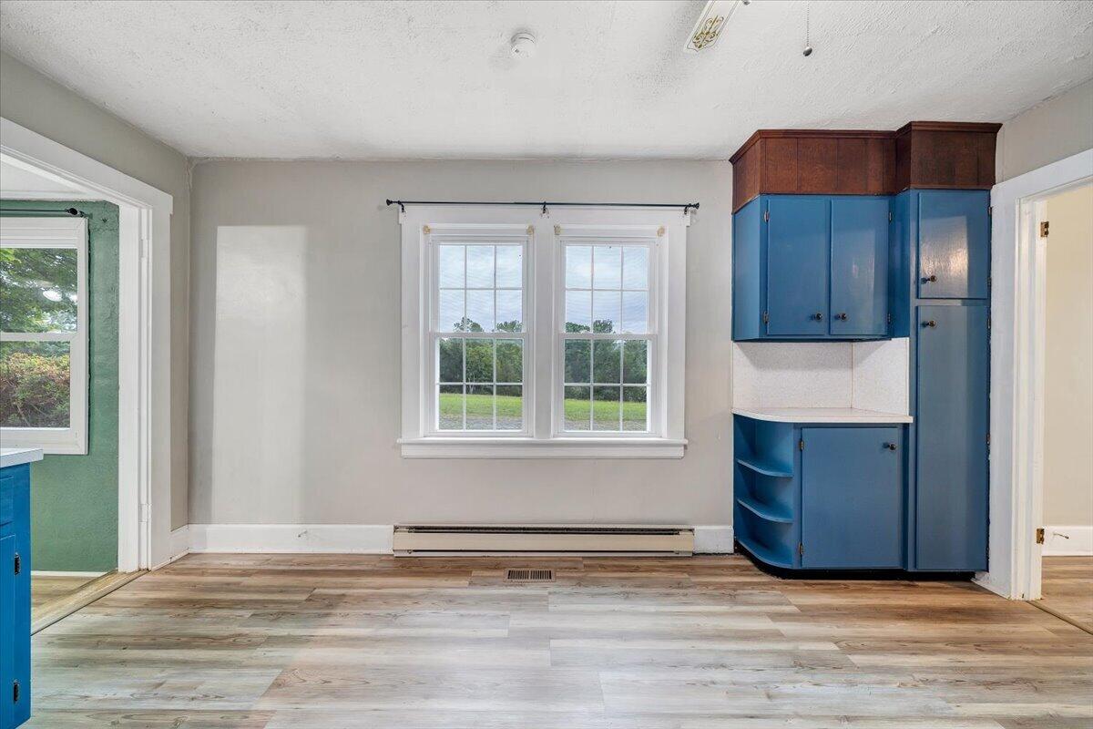 1384 Thaxton Mountain Road Thaxton, VA 24174 - Photo 14 of 44 a view of a kitchen with wooden floor and a cabinet