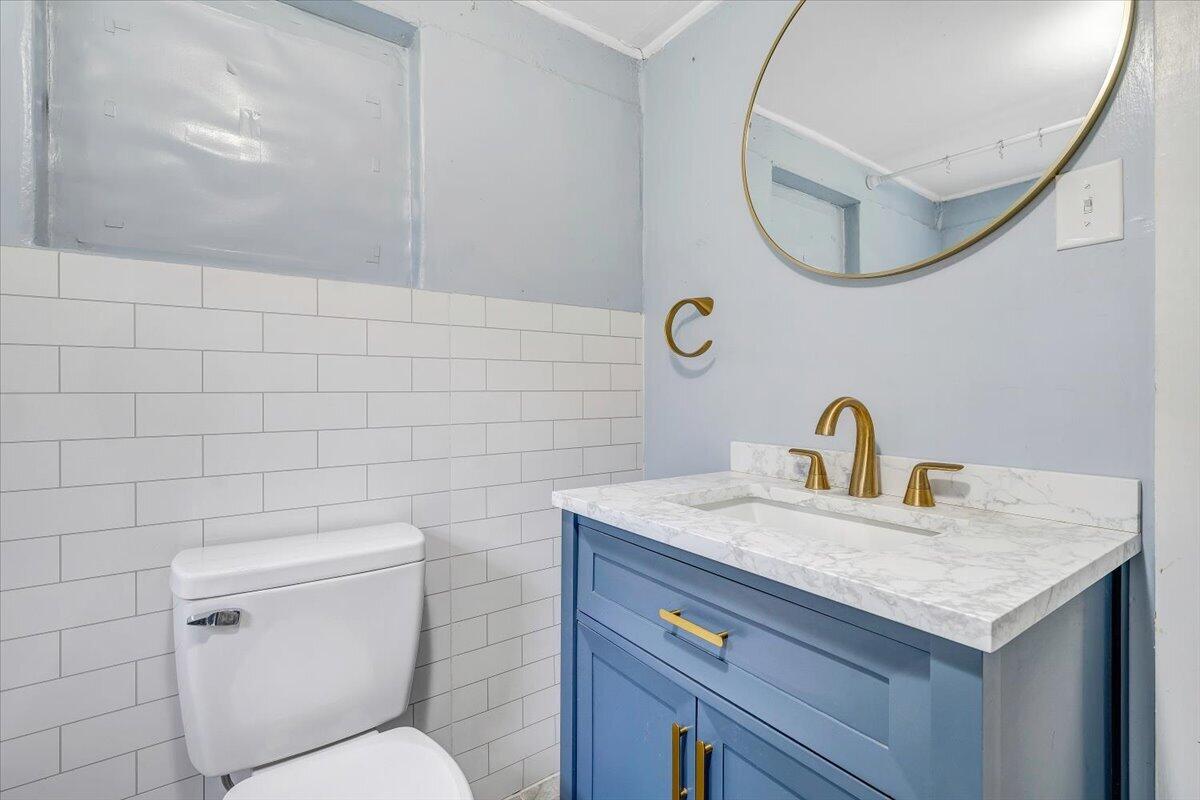 1384 Thaxton Mountain Road Thaxton, VA 24174 - Photo 22 of 44 a bathroom with a sink a toilet and a mirror
