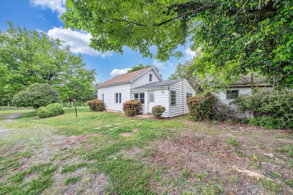 1384 Thaxton Mountain Road Thaxton, VA 24174 - Photo 37 of 44 a front view of a house with a yard and trees