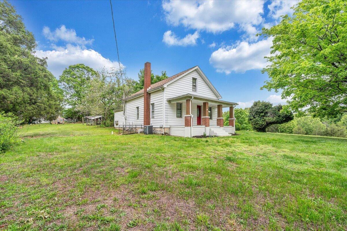 1384 Thaxton Mountain Road Thaxton, VA 24174 - Photo 40 of 44 a view of a house with a big yard potted plants and large tree