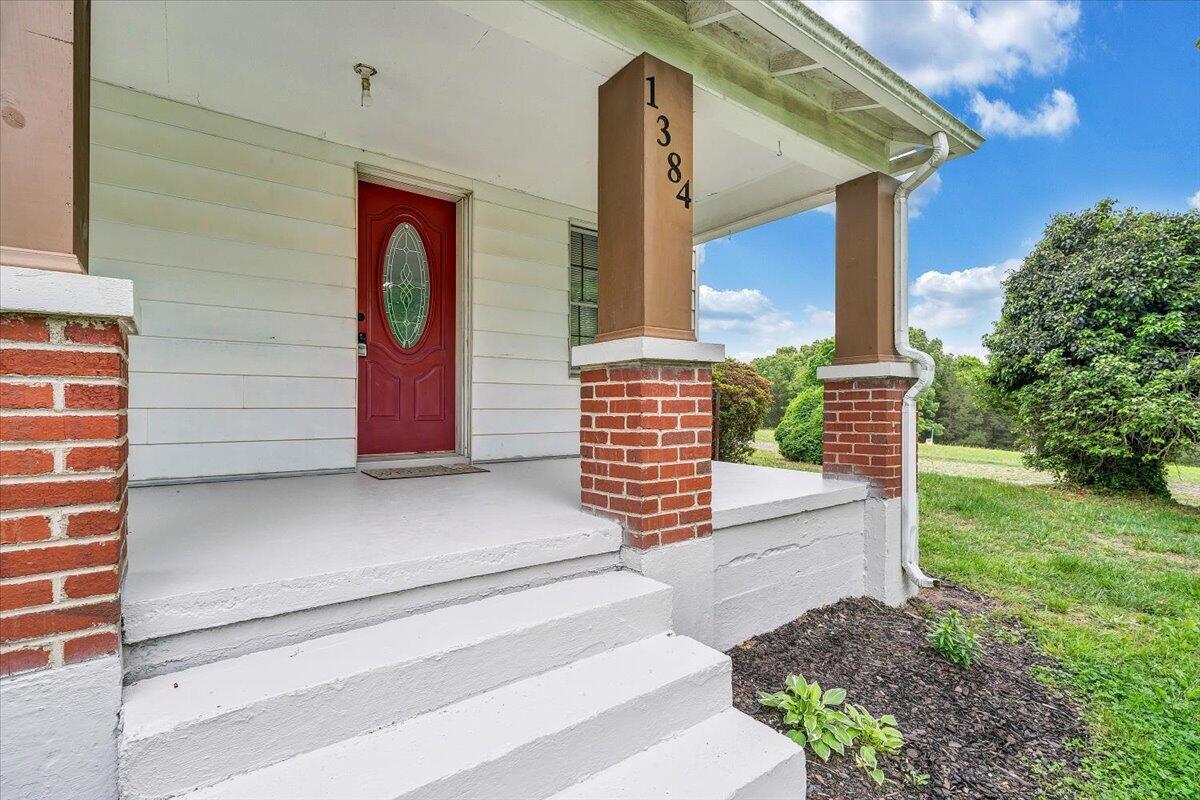 1384 Thaxton Mountain Road Thaxton, VA 24174 - Photo 3 of 44 a front view of a house with garden