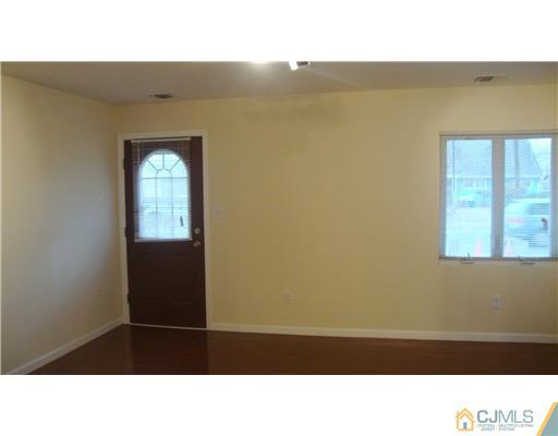 128 Idlewild Road Edison, NJ 08817 - Photo 2 of 9 a room with a window