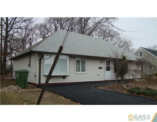 128 Idlewild Road Edison, NJ 08817 - Photo 9 of 9 a black and white photo of a house
