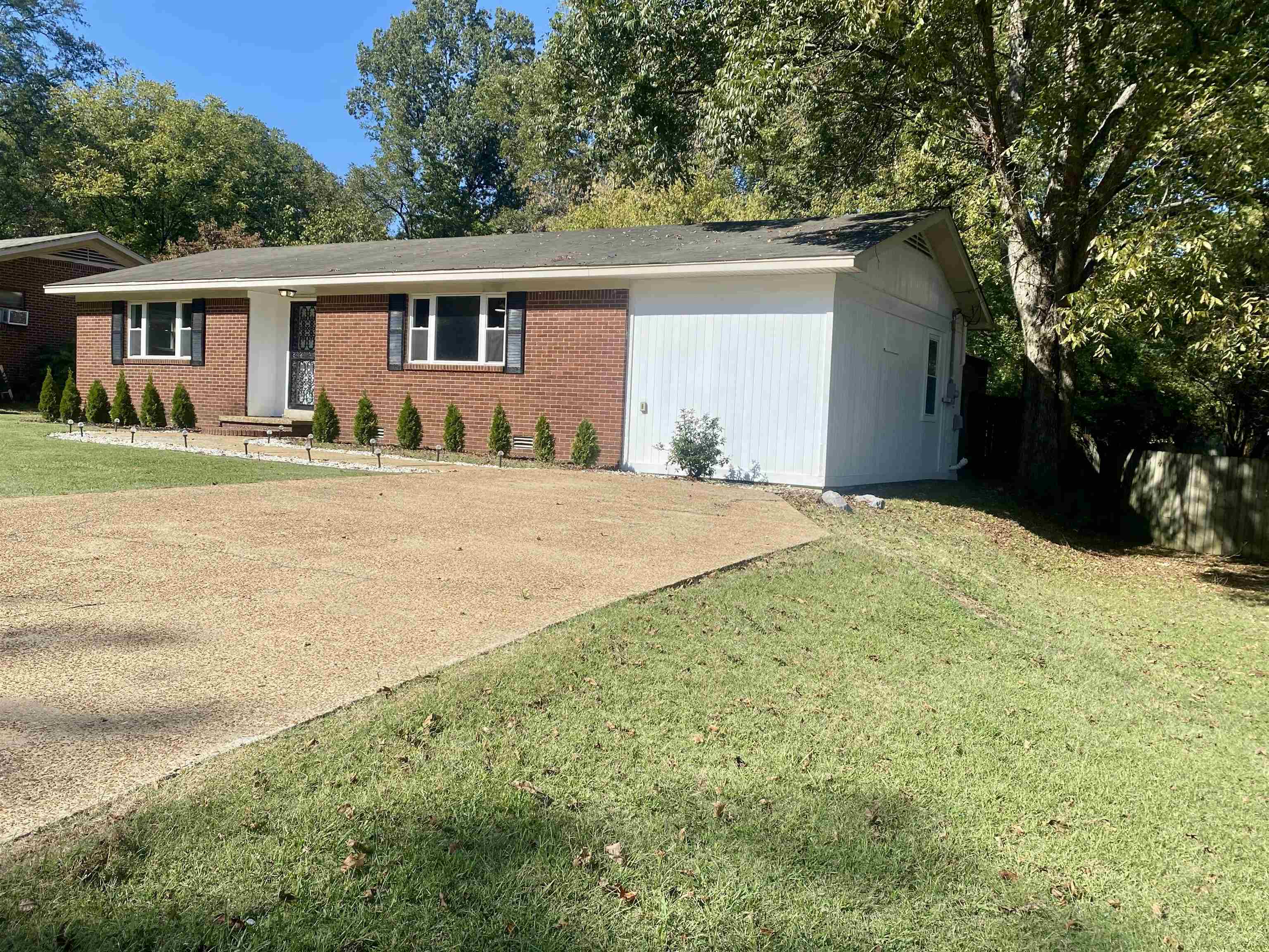 502 James Avenue Covington, TN 38019 - Photo 2 of 40 a view of a house with a yard and potted plants