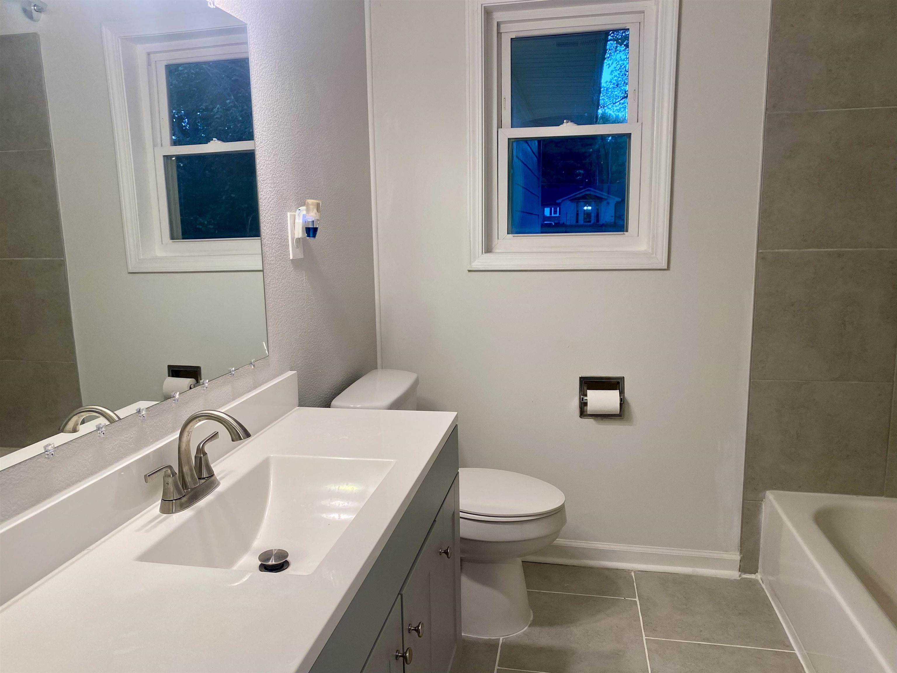 502 James Avenue Covington, TN 38019 - Photo 24 of 40 a bathroom with a sink and a toilet