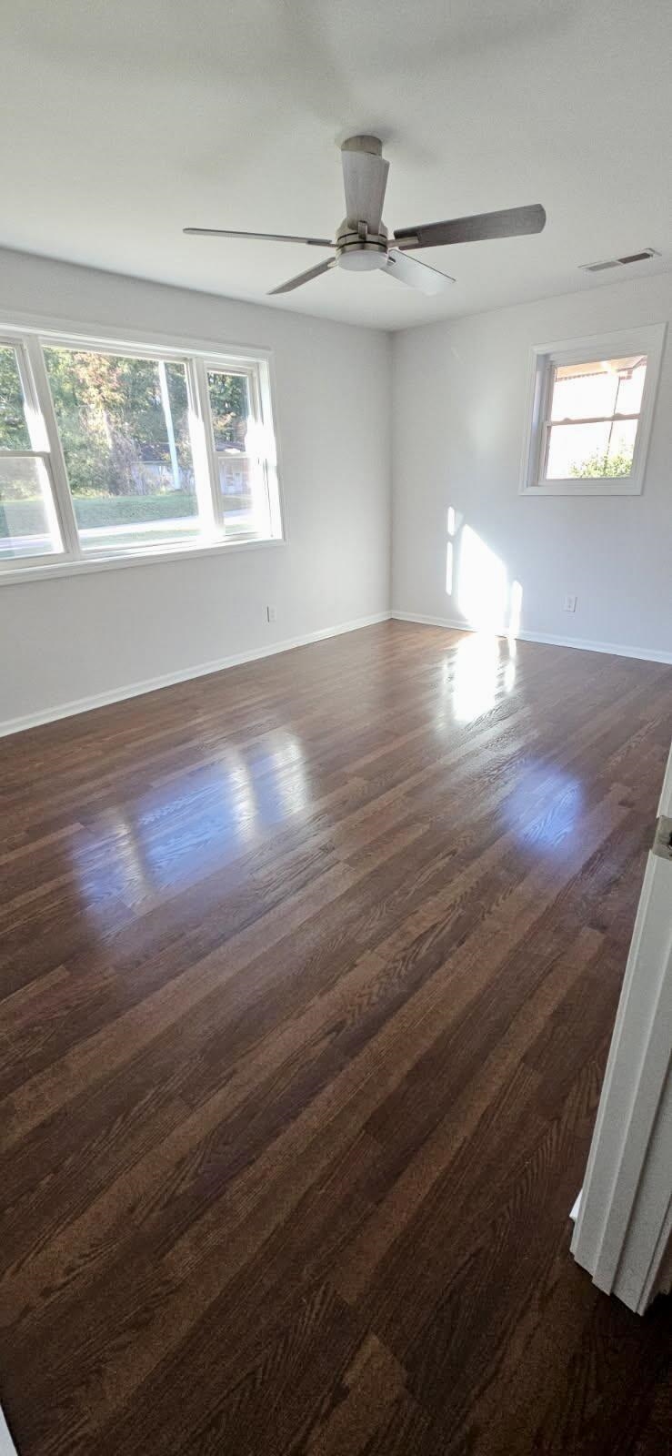 502 James Avenue Covington, TN 38019 - Photo 36 of 40 a view of empty room with wooden floor and fan
