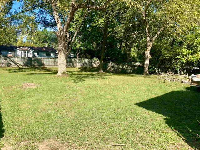 a view of swimming pool with a bench