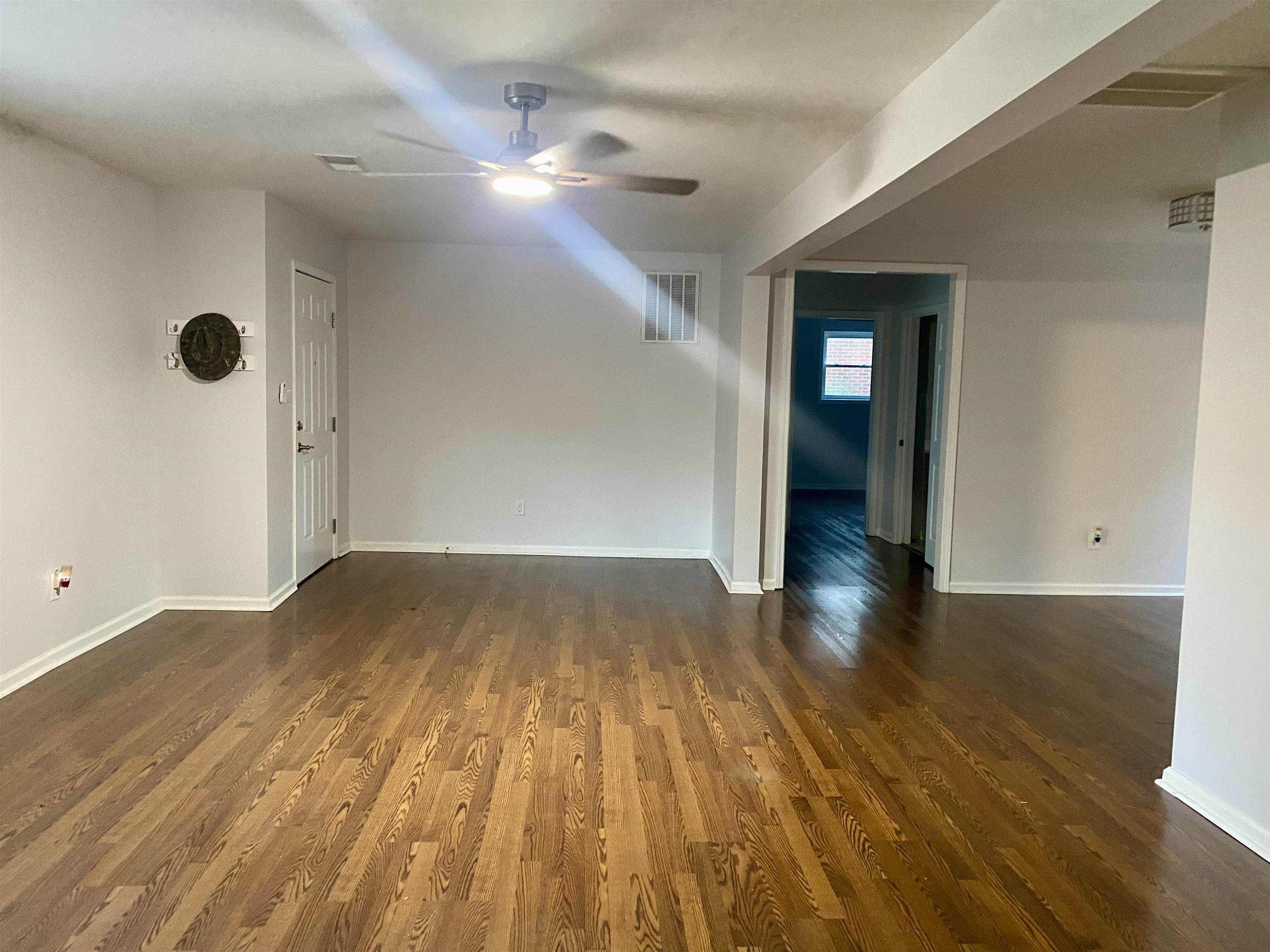 502 James Avenue Covington, TN 38019 - Photo 10 of 40 a view of empty room with wooden floor