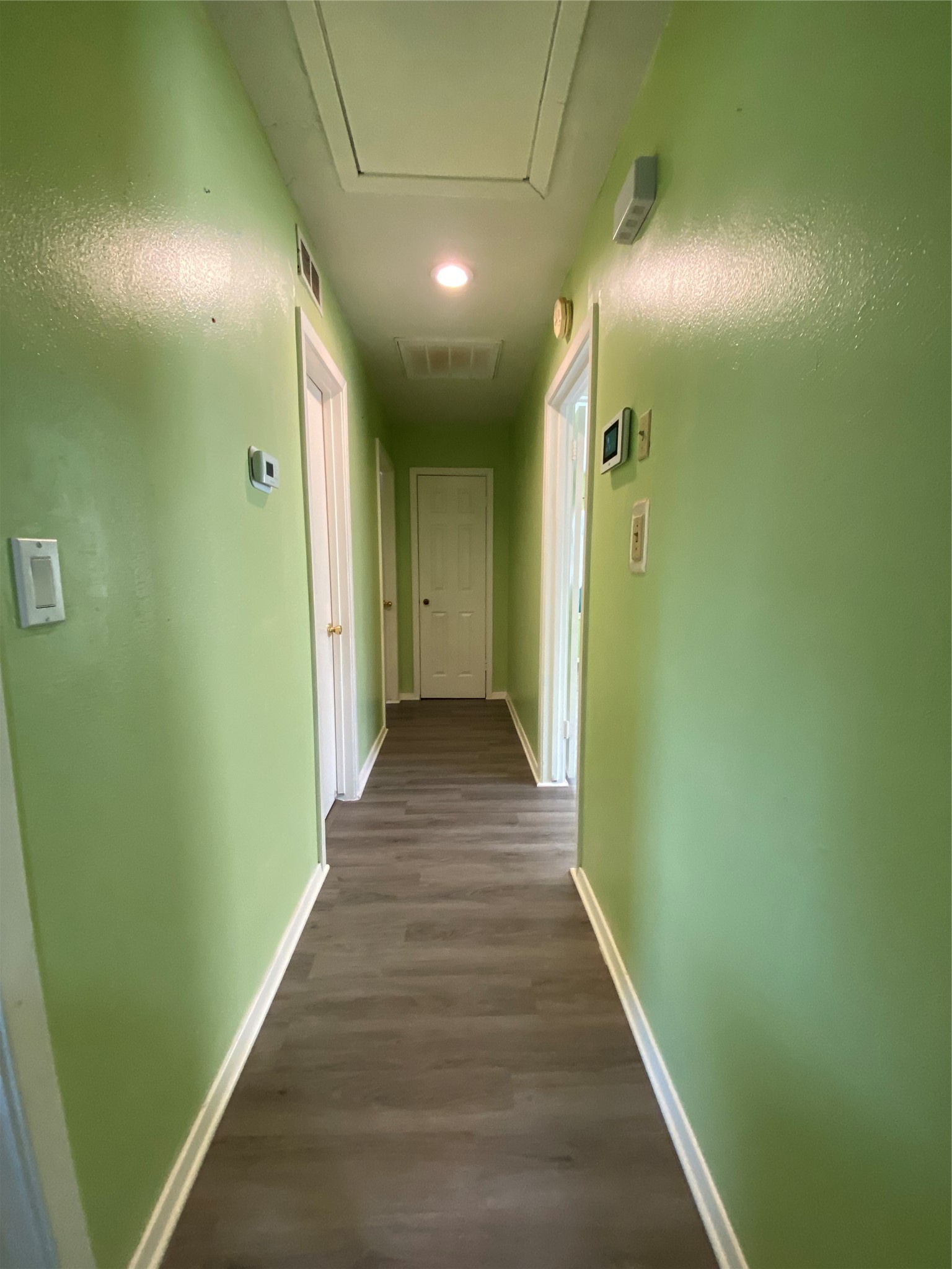 15513 Vonnet Street Channelview, TX 77530 - Photo 4 of 10 a view of a hallway with wooden floor