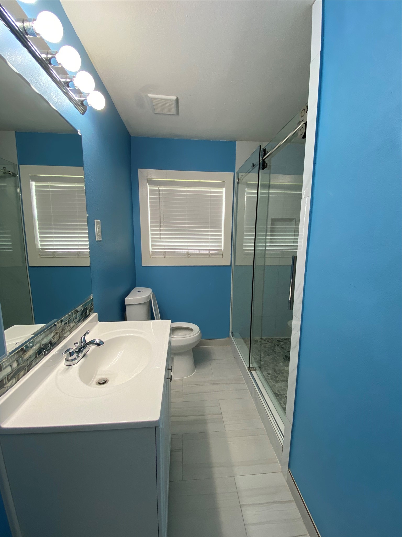 15513 Vonnet Street Channelview, TX 77530 - Photo 8 of 10 a bathroom with a sink a toilet and shower