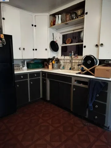 a kitchen with a sink and cabinets