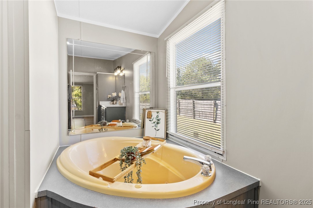 1334 East Green Springs Road Parkton, NC 28371 - Photo 18 of 32 a view of a swimming pool from a dining room