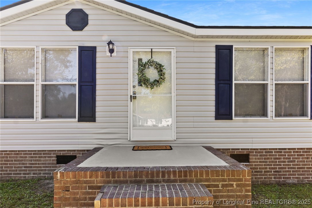 1334 East Green Springs Road Parkton, NC 28371 - Photo 2 of 32 a front view of a house with a yard