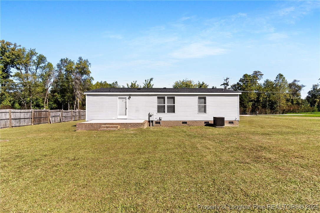 1334 East Green Springs Road Parkton, NC 28371 - Photo 29 of 32 a view of a yard with a house