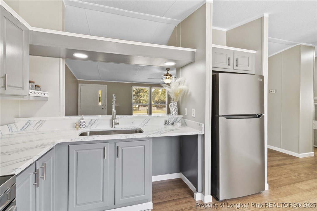 1334 East Green Springs Road Parkton, NC 28371 - Photo 10 of 32 a kitchen with a sink and refrigerator