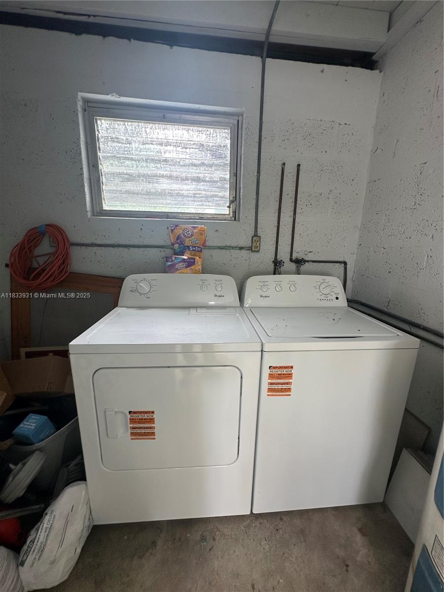 809 Northeast 2nd Street, Unit 12 Hallandale Beach, FL 33009 - Photo 10 of 19 a utility room with dryer and washer